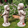 resin boy and girl garden sculpture